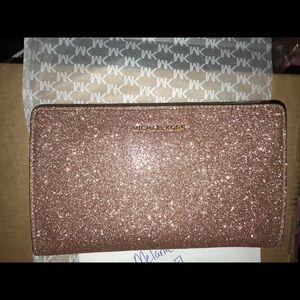 Brand new Michael kors rose gold large clutch
